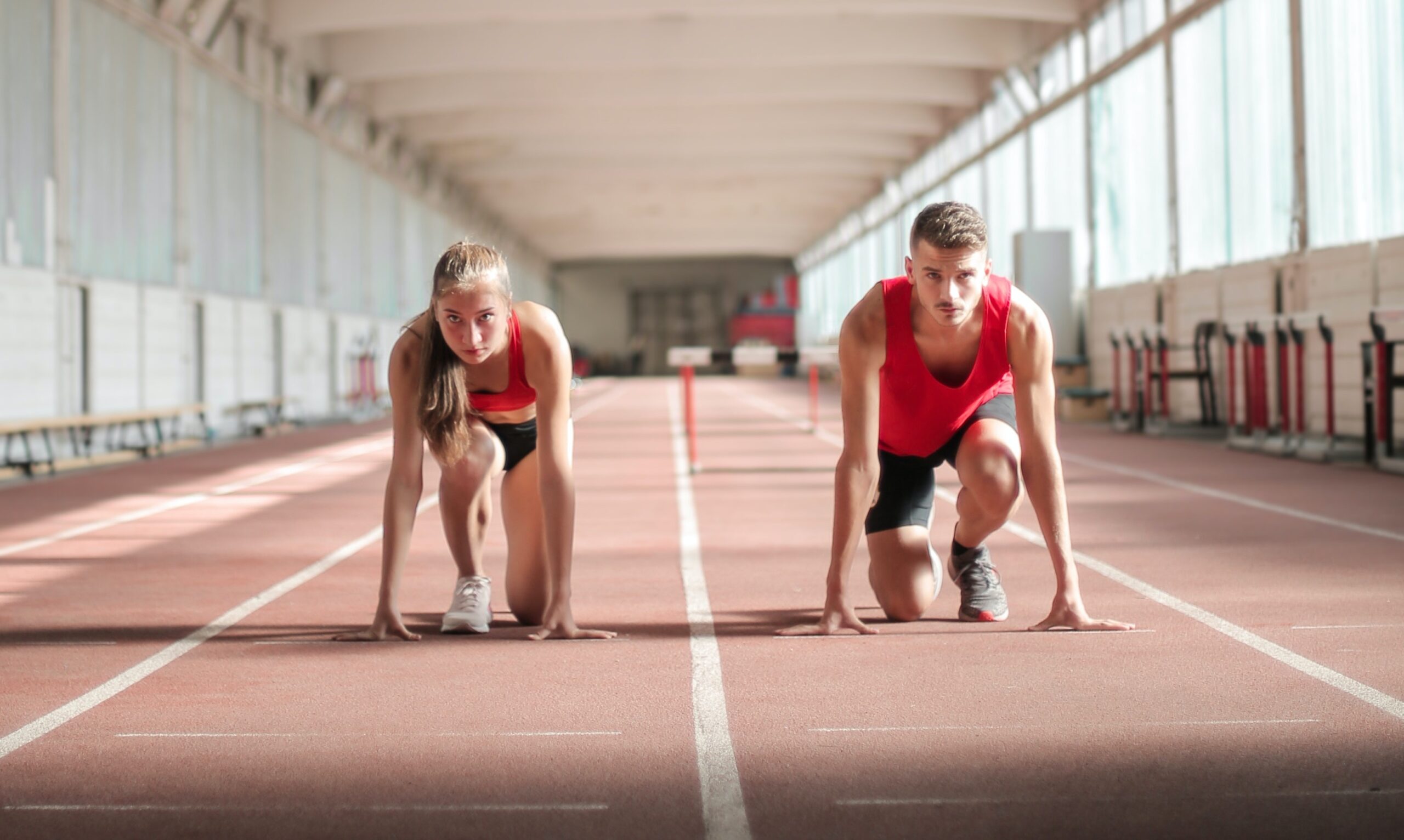 A man and a woman prepare to race